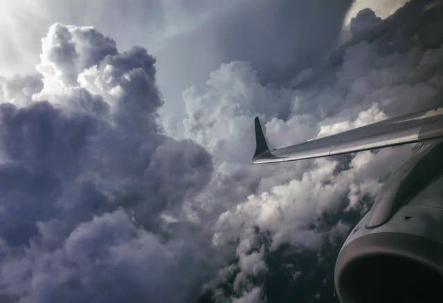 Twin engine airliner avoiding area of turbulence.